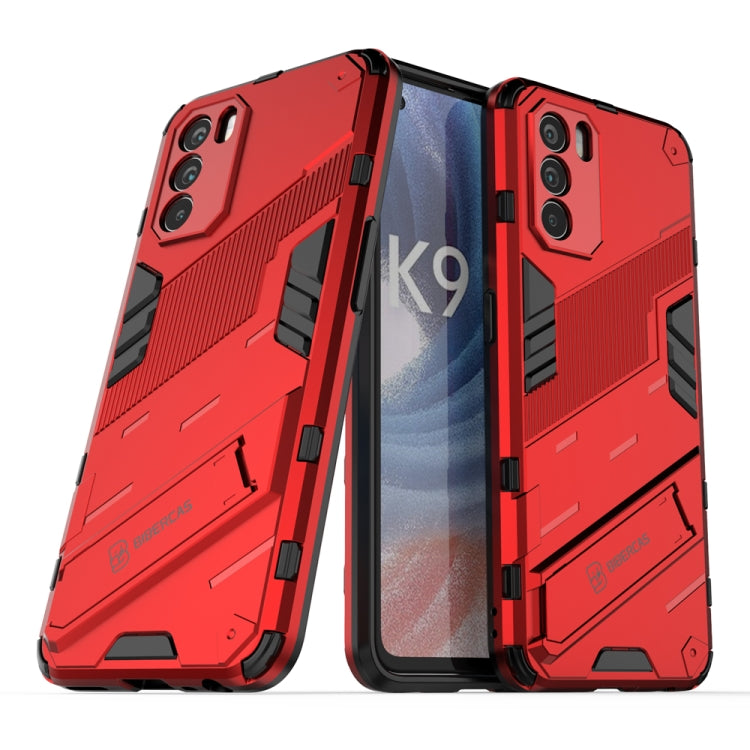 Rugged red phone case with textured grip, raised edges, and dual-layer protection