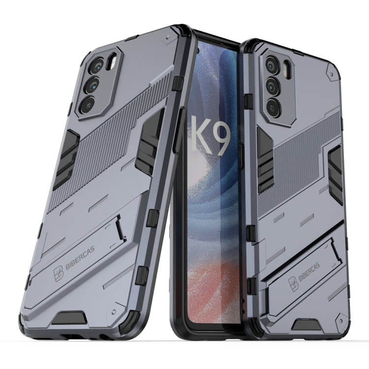 Rugged gray phone case with textured grip, raised edges, and dual-layer protection