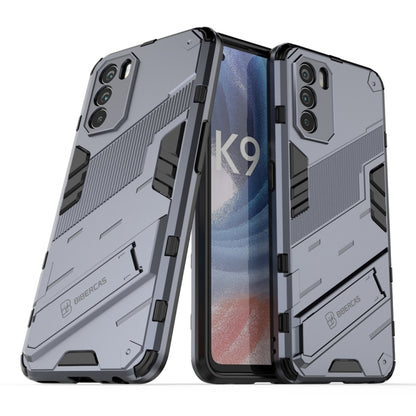 Rugged gray phone case with textured grip, raised edges, and dual-layer protection