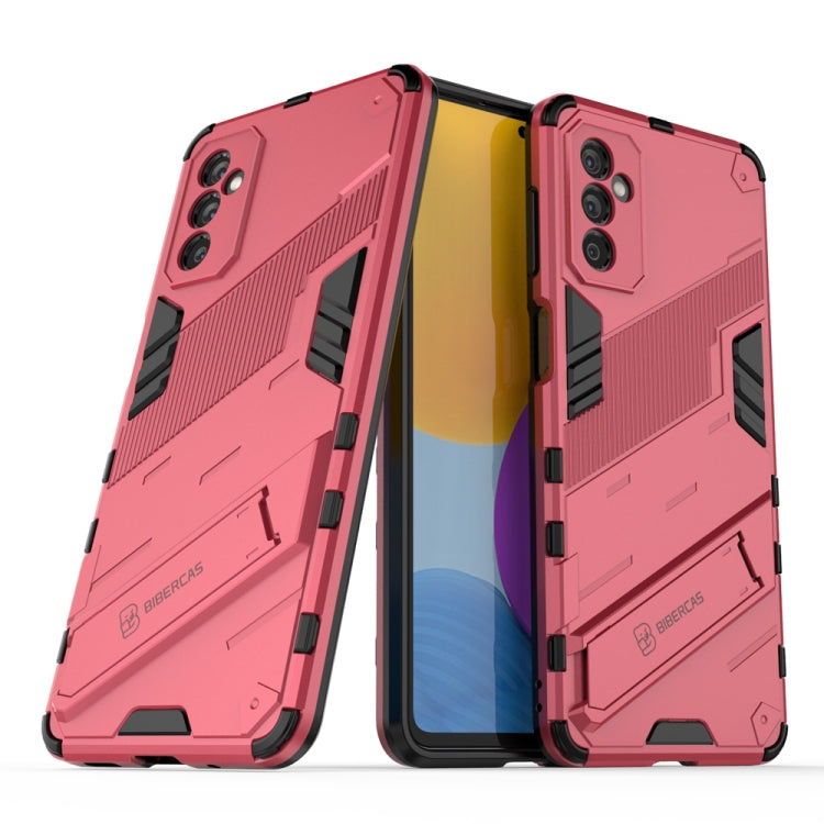 Pink shockproof phone case with rugged armor texture and camera cutouts