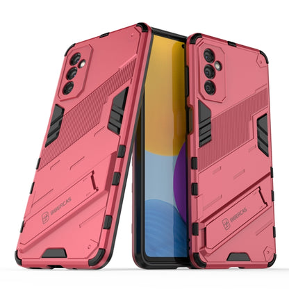 Pink shockproof phone case with rugged armor texture and camera cutouts