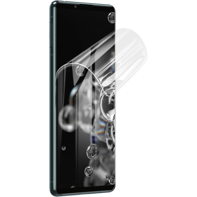 Curved transparent hydrogel screen protector film covering a phone display