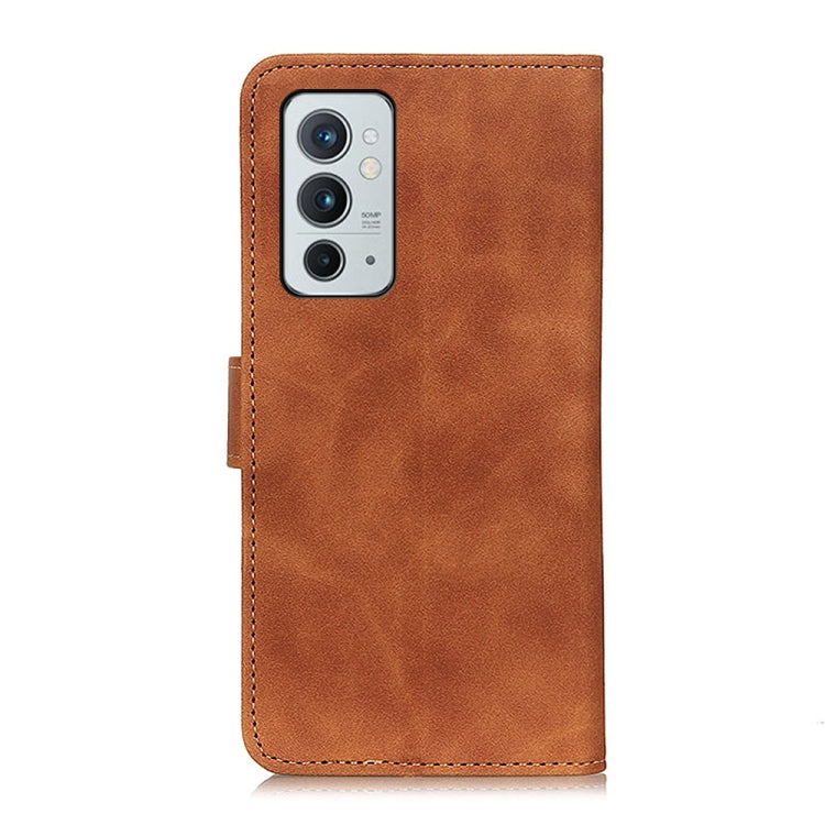 Brown leather flip phone case with camera cutout and top opening