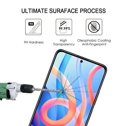 Tempered glass screen protector shown on a smartphone screen during impact test.