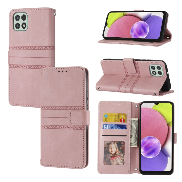 Pink leather flip phone case with embossed stripes, magnetic closure, and card slots