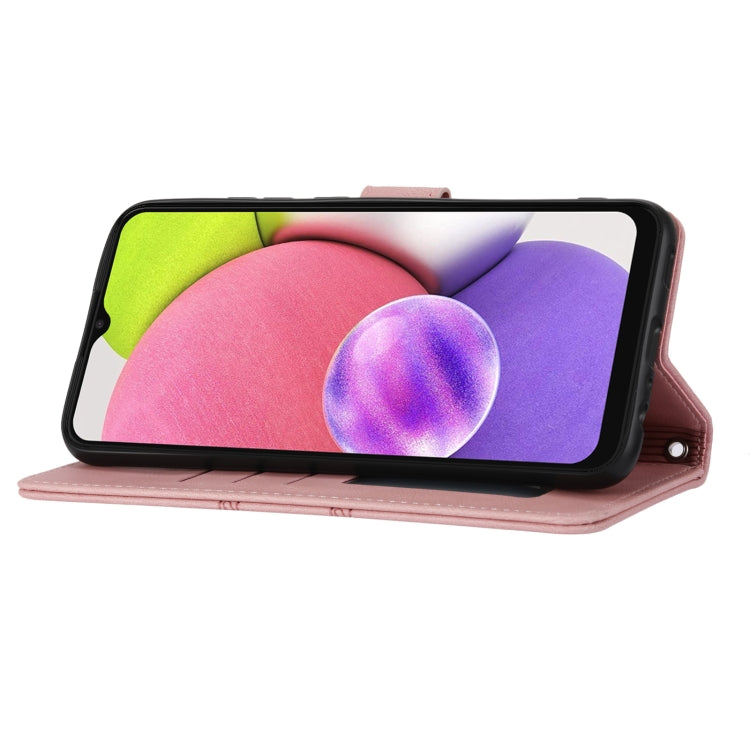 Pink leather flip phone case in landscape view with magnetic closure and embossed stripes