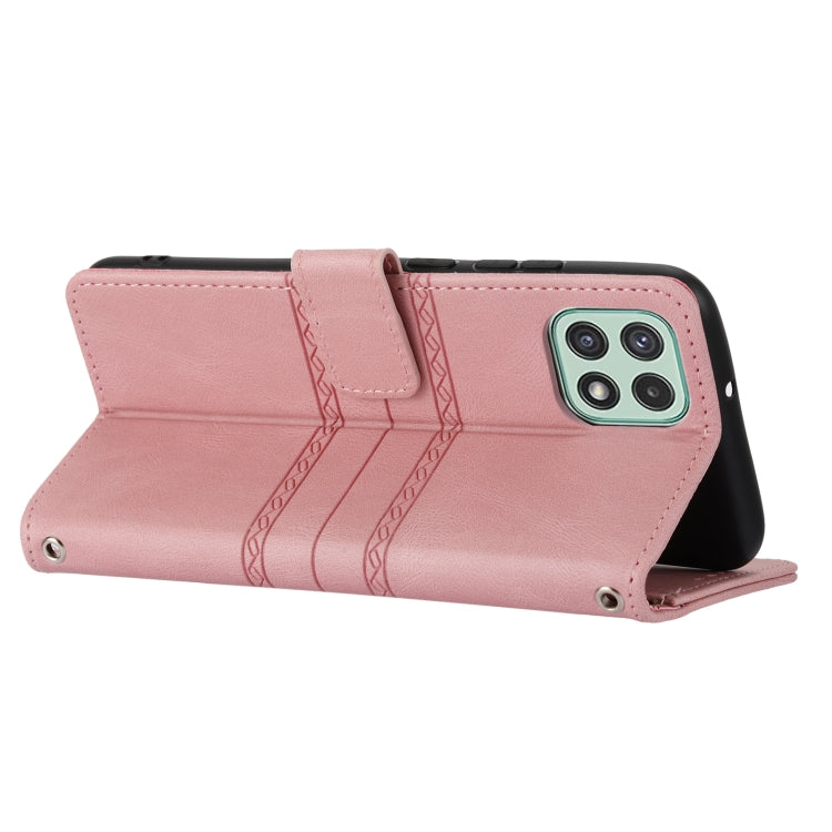 Pink leather flip phone case with embossed chevron stripes and magnetic clasp