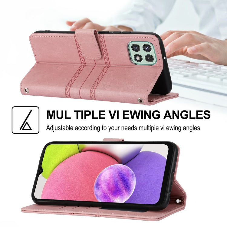 Pink leather flip phone case with embossed stripes, magnetic clasp, and wrist strap