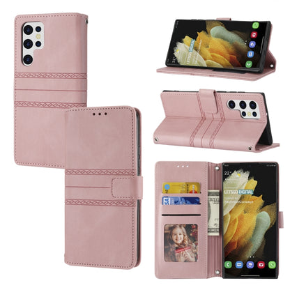 Light pink leather flip phone case with embossed stripes, magnetic buckle, and card slots