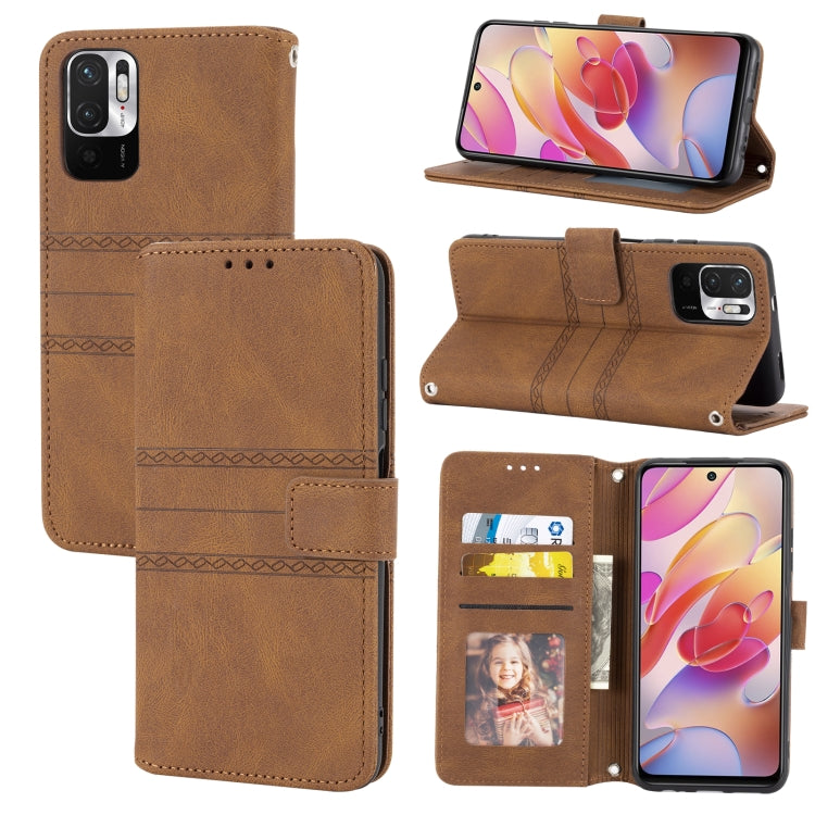 Brown leather flip phone case with embossed stripes, magnetic buckle, and card slots