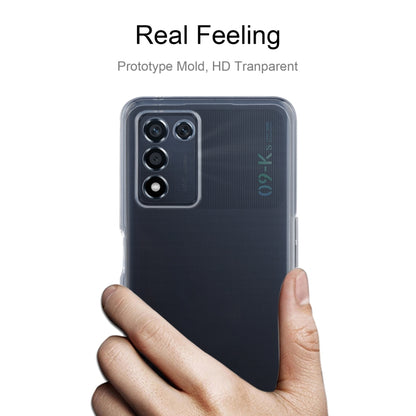 Clear TPU phone case held in hand, showing camera cutout and slim fit