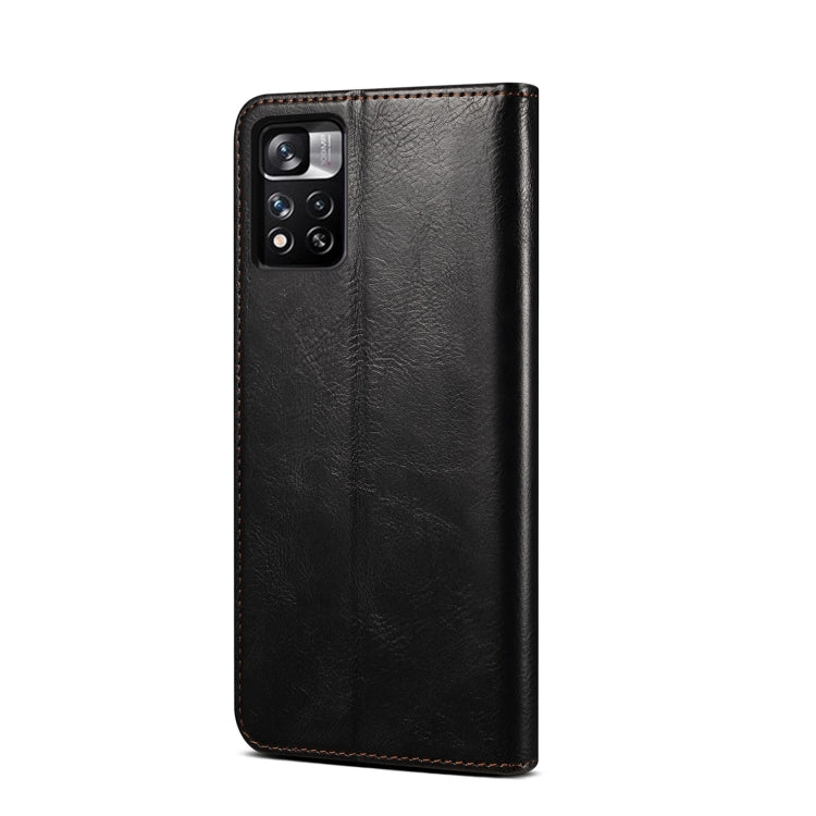 Black leather phone case with camera cutout and textured finish, stitched edges
