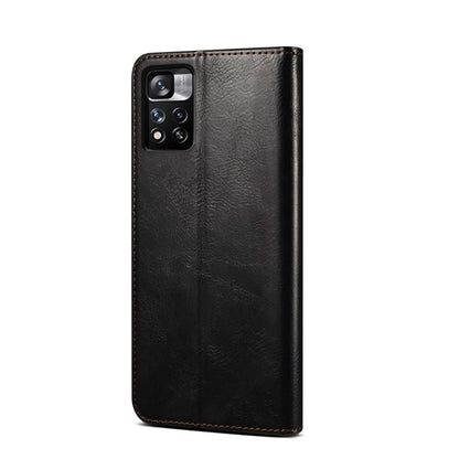 Black leather phone case with camera cutout and textured finish, stitched edges
