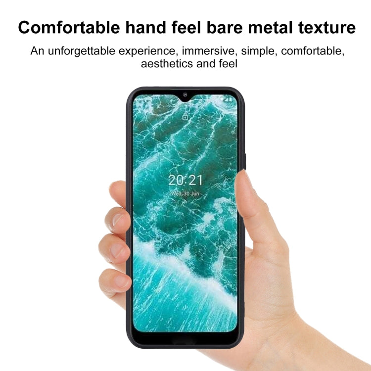 TPU phone case for Nokia C30 in matte black, held in hand with button cutouts