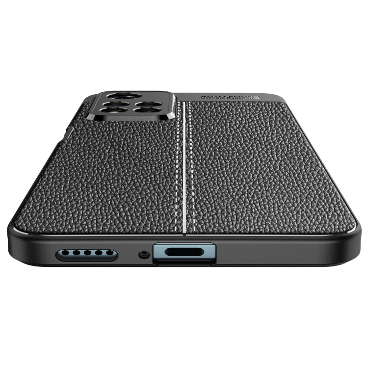Black shockproof TPU phone case with litchi texture, bottom port openings and speaker cutout