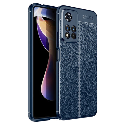 Blue shockproof TPU phone case with litchi-texture back and raised camera cutouts