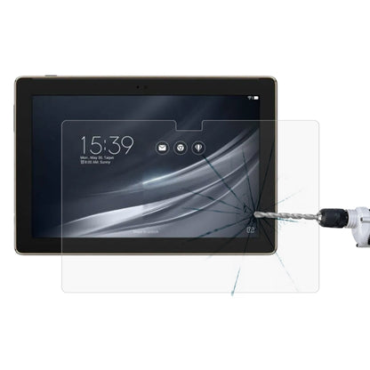 Tempered tablet screen protector film covering a dark tablet screen with impact crack lines