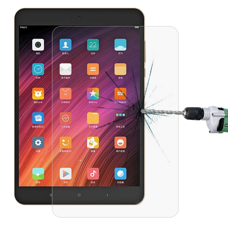 Tempered glass screen protector film on a tablet screen with visible scratch-test crack