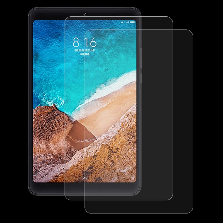 Clear tempered glass screen protector film on a tablet, leaving camera and sensors accessible.