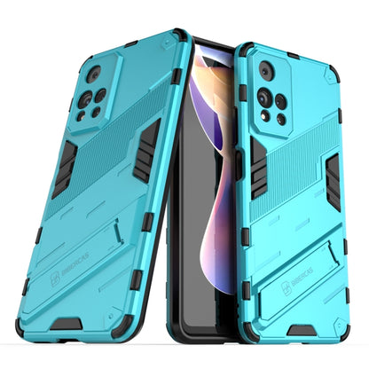Turquoise shockproof phone case with raised armor edges and black strap detail