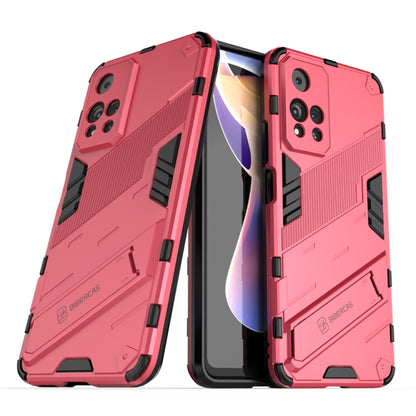 Red shockproof phone case with raised armor edges and black strap detail