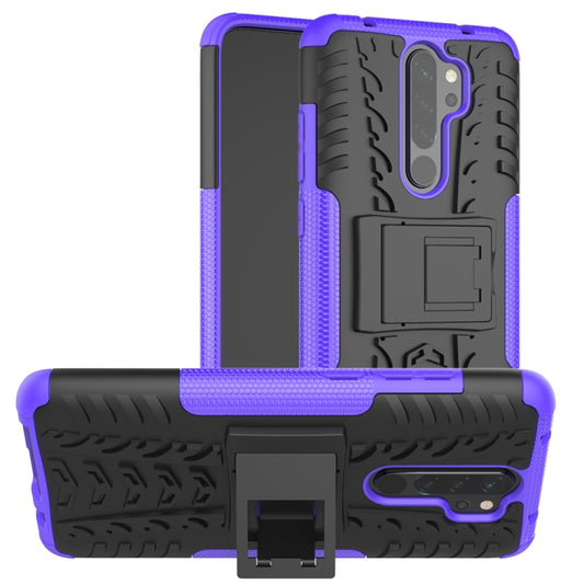 Purple and black rugged phone case with tire-traction texture and built-in holder