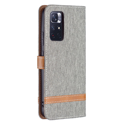 Grey denim-texture phone wallet case with leather strap and camera cutout