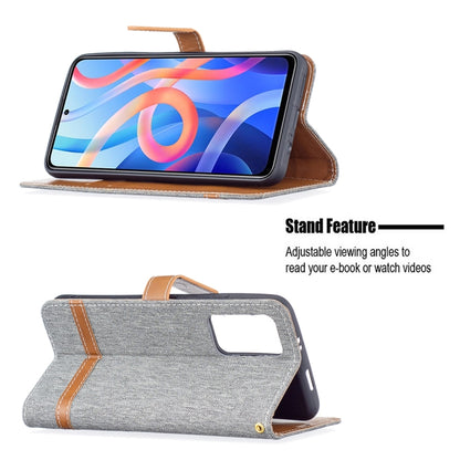 Grey denim-texture phone wallet case with stand, card slot window, and lanyard