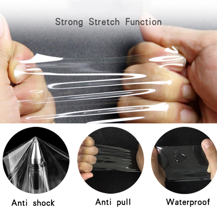 Stretchable hydrogel screen protector film being pulled flat for installation