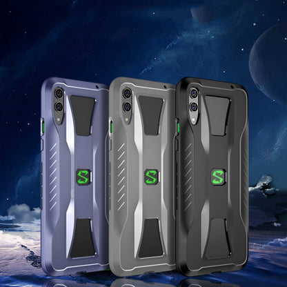 Set of three phone cases in black, grey, and light grey with textured armor pattern