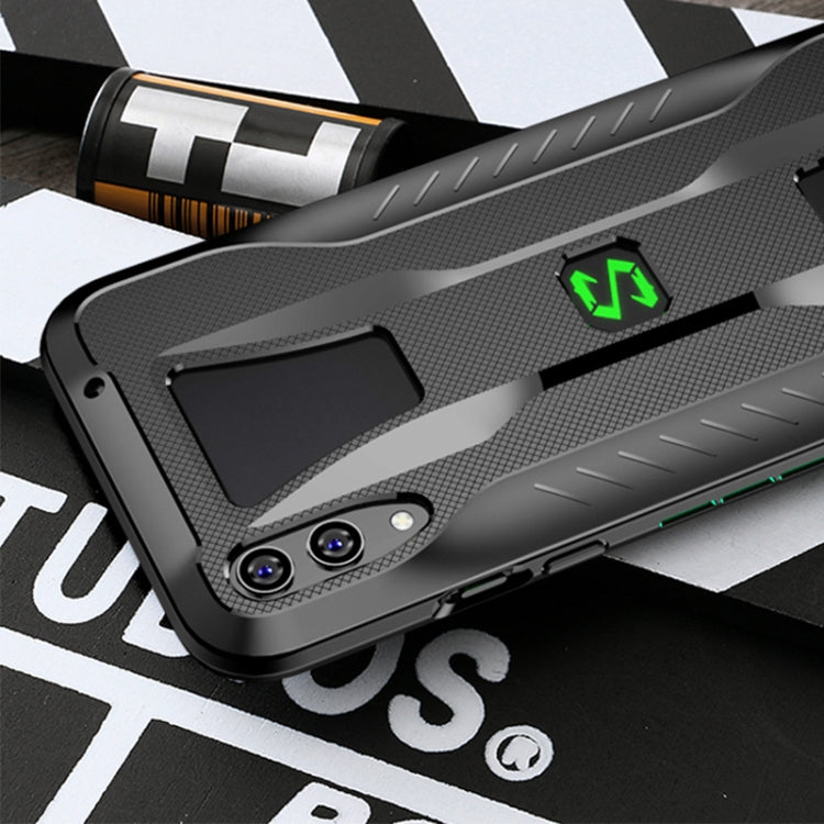 Grey phone case with dual camera cutouts and textured pattern, green logo detail