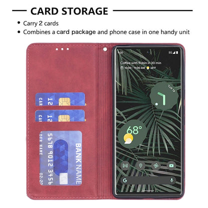 Red leather card storage flap showing slots with a phone inside the case.