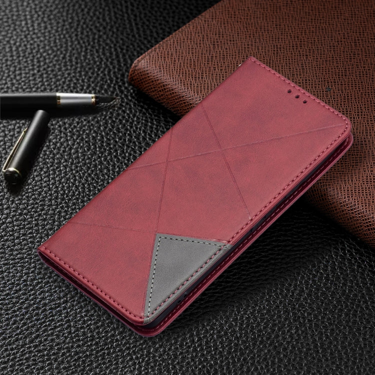 Red leather flip phone case with gray accent insert and stitched diamond design.