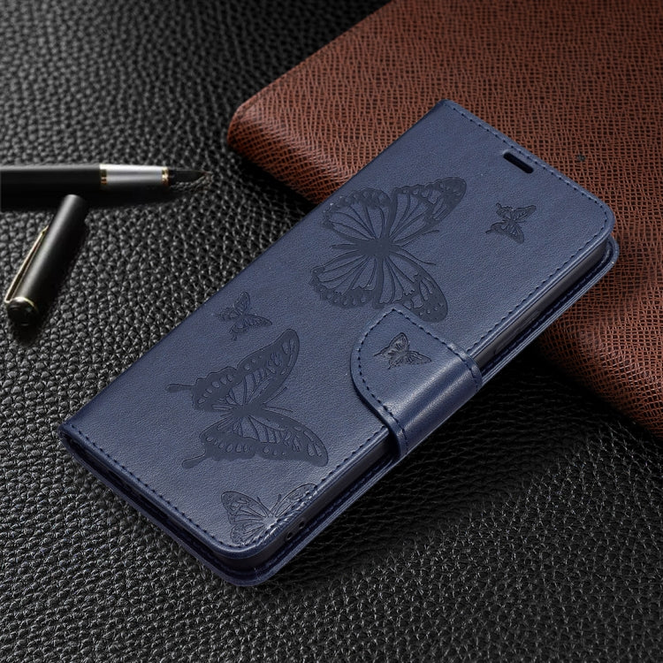 Dark blue leather phone case with embossed butterflies and flip cover, with strap attachment.