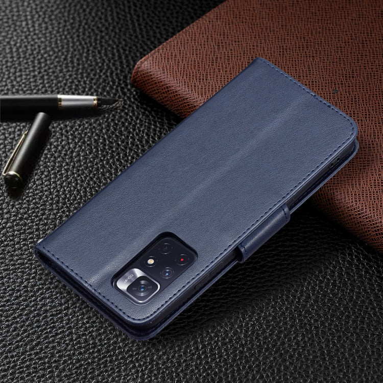 Dark blue leather phone case with embossed butterflies, showing camera cutout on the back.