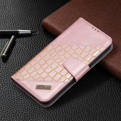 Rose gold leather-look phone case with gold crocodile texture and magnetic-style strap