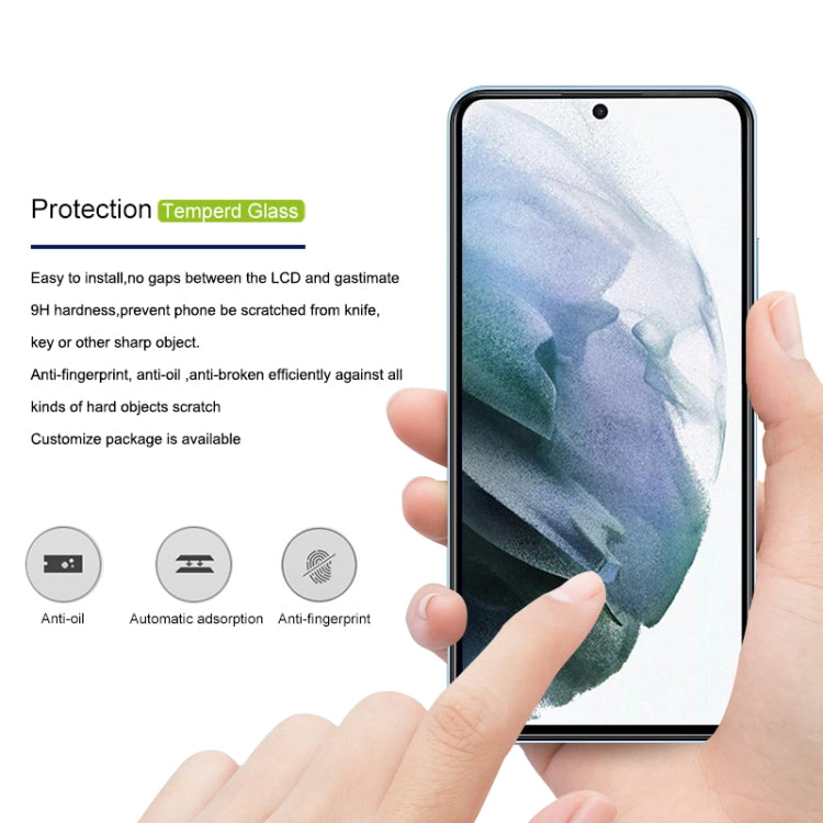 mocolo clear tempered glass screen protector on a phone display, hand pressing