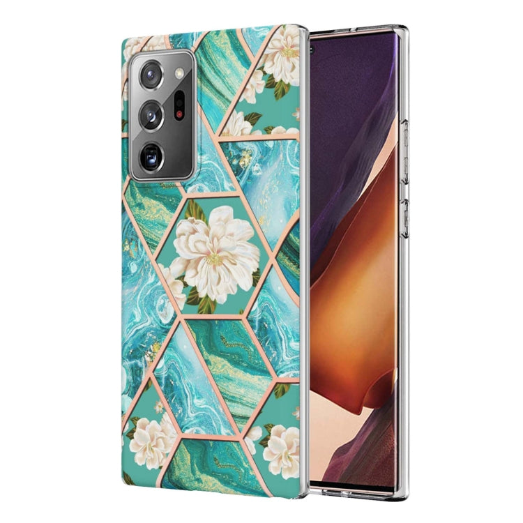 Teal TPU phone case with marble hexagon pattern, cream flowers, and camera openings