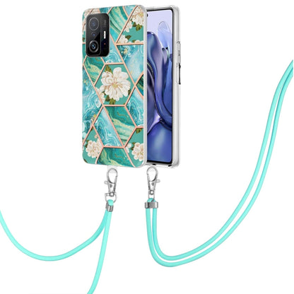 Blue floral TPU phone case with hex marble pattern and turquoise lanyard