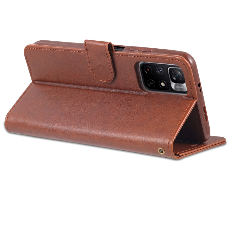 Brown leather flip phone case with built-in stand and visible camera opening