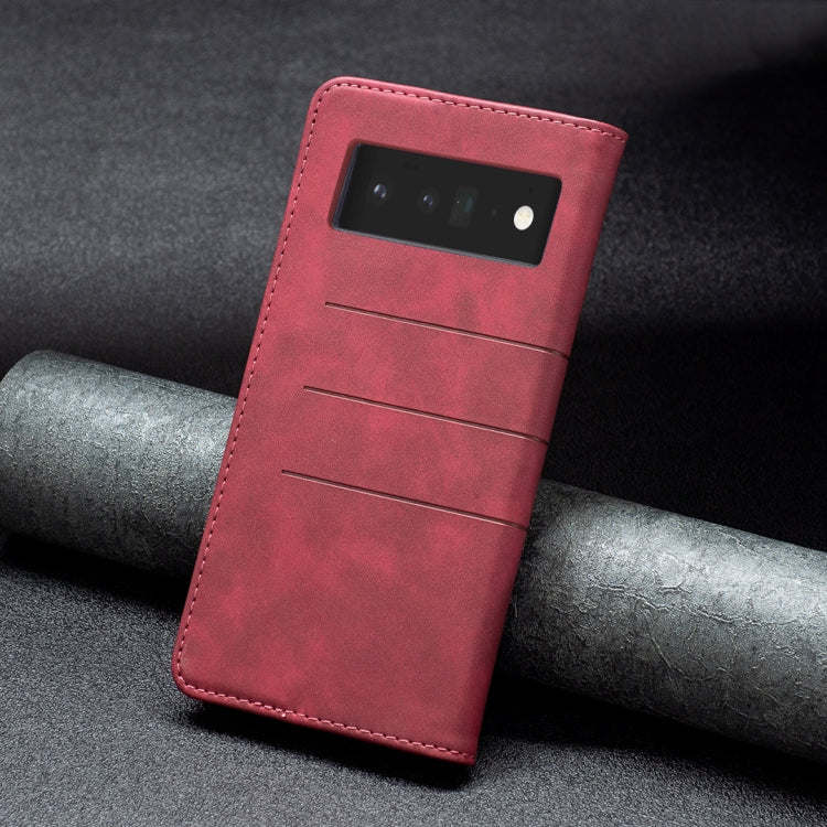 Red leather folio phone case with camera window and card pocket on back