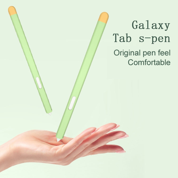 Two light green stylus protective cases held in a hand