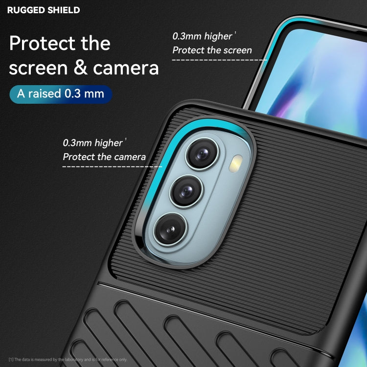 Black shockproof TPU phone case with blue camera ring and textured pattern
