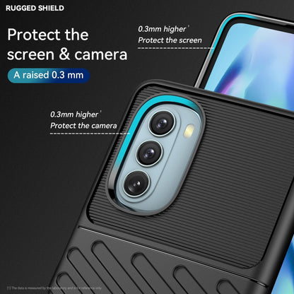 Black shockproof TPU phone case with blue camera ring and textured pattern