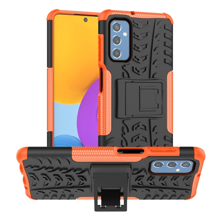 Tire-texture TPU phone case with holder, orange edges and black back