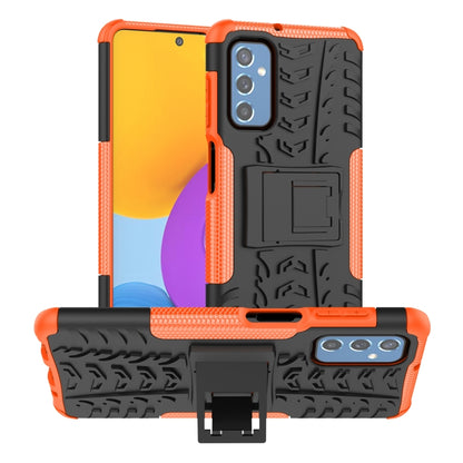 Tire-texture TPU phone case with holder, orange edges and black back