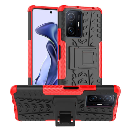 Red and black tire-texture phone case with holder, raised camera cover, and cutouts