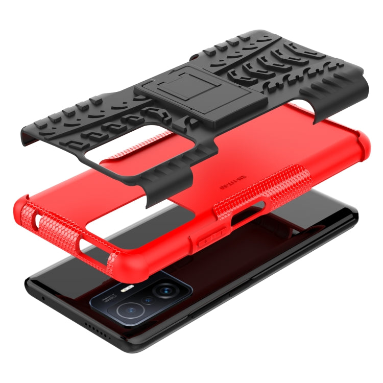 Red and black rugged phone case with tire tread texture and built-in stand/holder