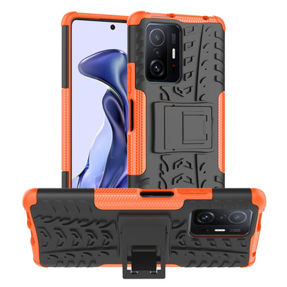 Orange tire-texture phone case with built-in holder and rugged TPU/PC bumper