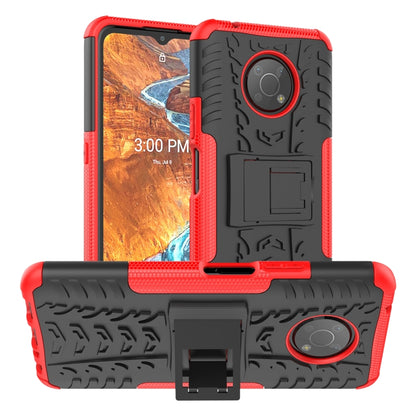 Red tire-texture phone case with built-in holder and rugged TPU/PC bumper